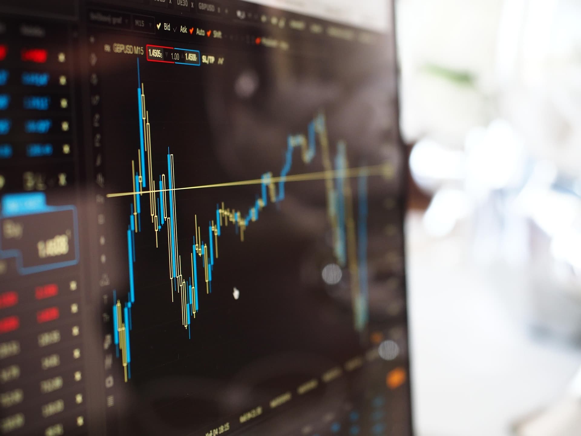 A picture of a laptop with stock market open